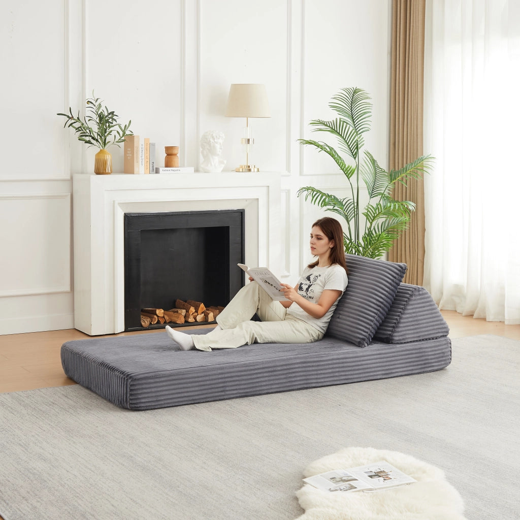 Divano modulare in corduroy grigio con schienali triangolari e braccioli regolabili