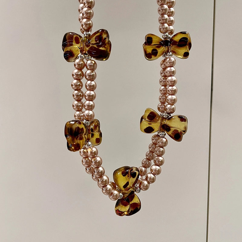 Collana girocollo a doppio strato con perle dal design retr¨° e stampa leopardata con fiocco.