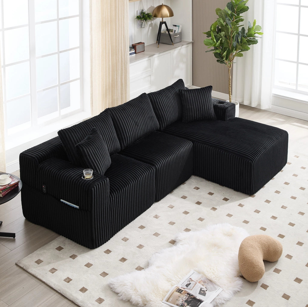 Divano modulare 257x160x62 cm con 5 cuscini; tasche laterali e portabicchieri in velluto a coste nero