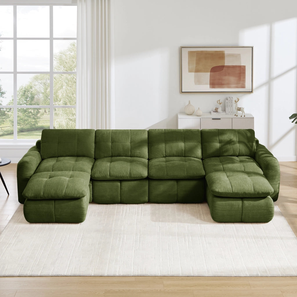 Divano modulare a U senza struttura con seduta ampia e profonda design trapuntato in ciniglia verde con due pouf