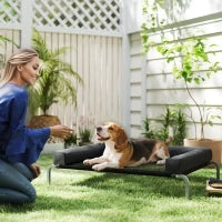 Lettino per Cani Rialzato di 19.5 cm con Cuscino a U, in Poliestere e Acciaio, 110x75x30 cm, Nero e Argento
