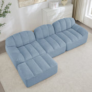 Divano modulare angolare 3 posti con ottomana 288x165x79 cm in fleece granulare blu