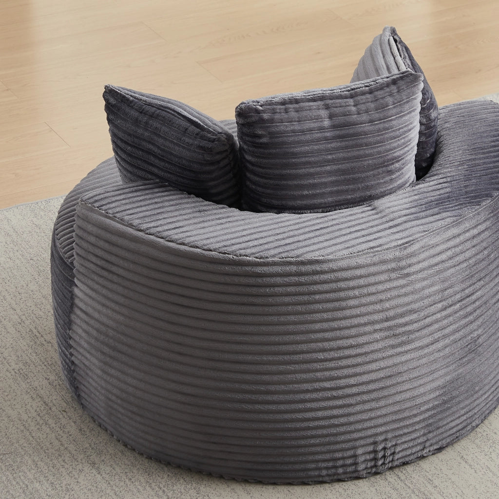 Poltrona lounge rotonda con 3 cuscini e braccioli larghi; design minimalista in velluto a coste grigio