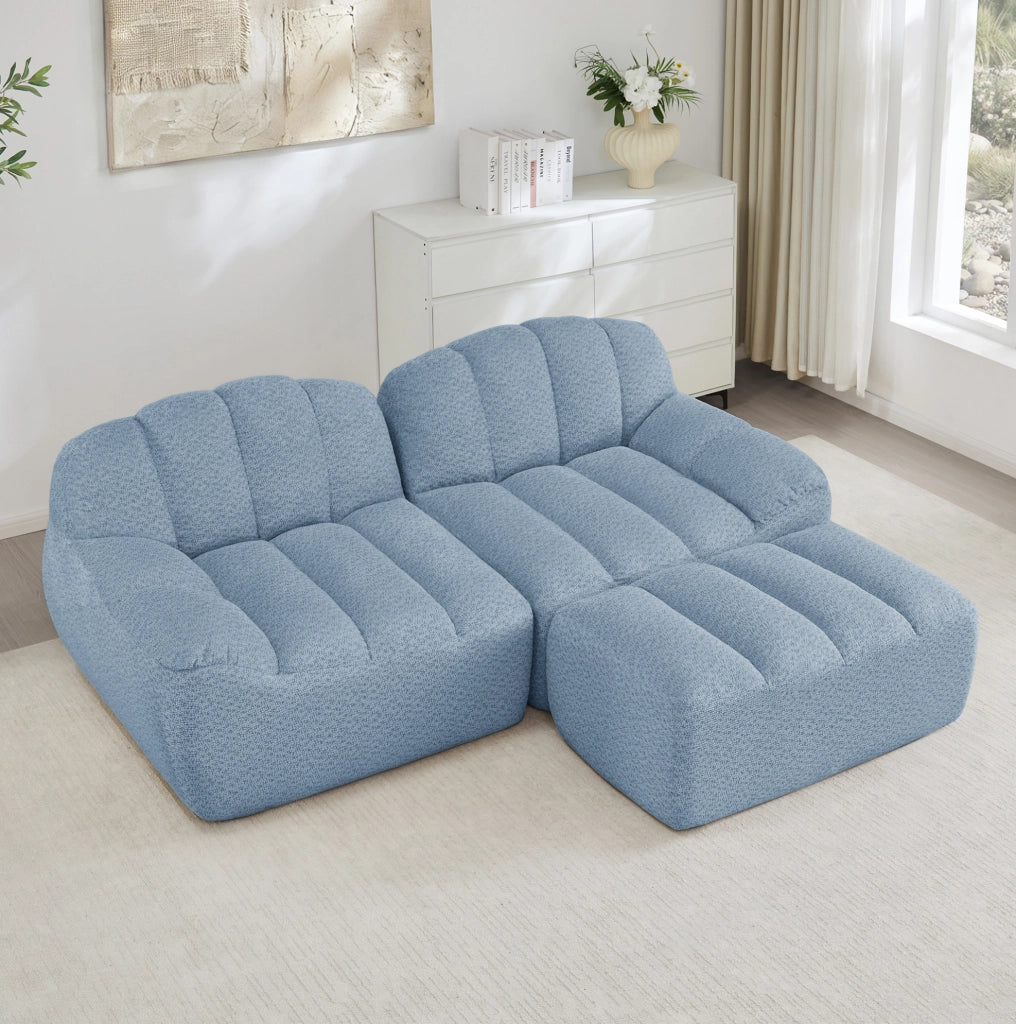 Divano angolare modulare 2 posti con pouf in pile granulato blu HOMVRA