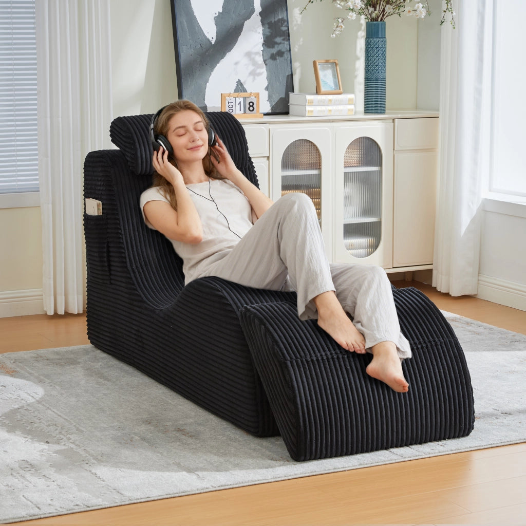 Fauteuil con design singolo ergonomico con poggiatesta e tasca laterale in velluto a coste nero