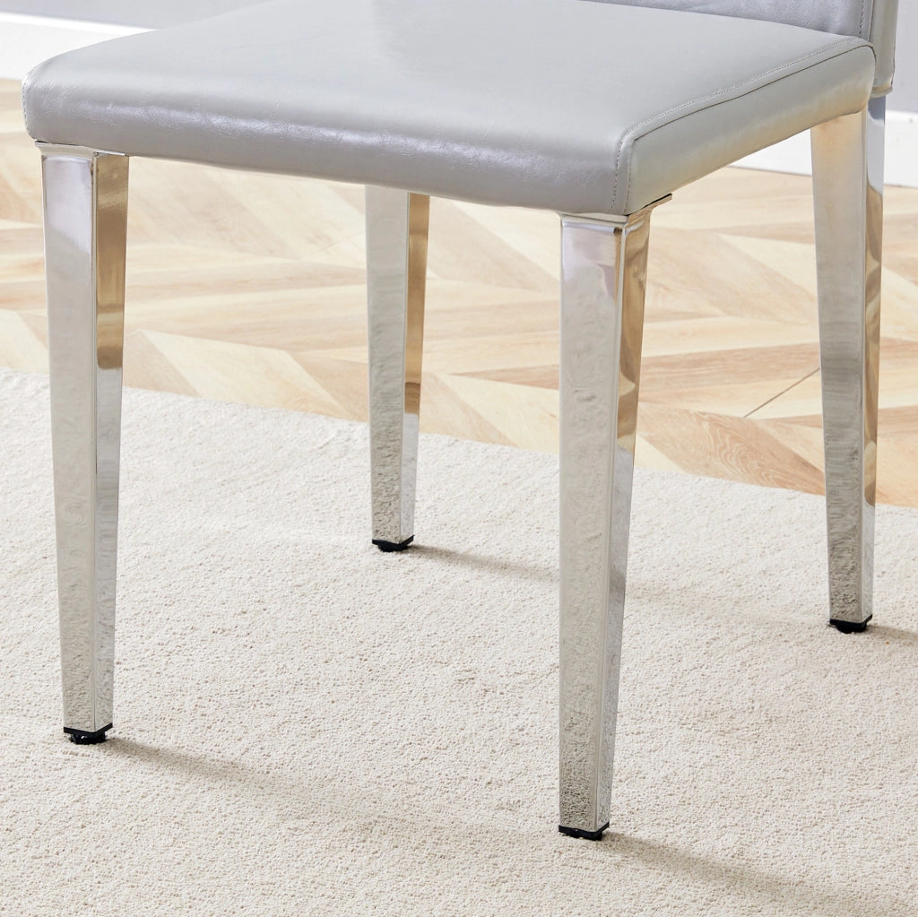 Set 2 sedie da pranzo moderne in PU grigio chiaro con gambe in metallo argentato; h 90 cm