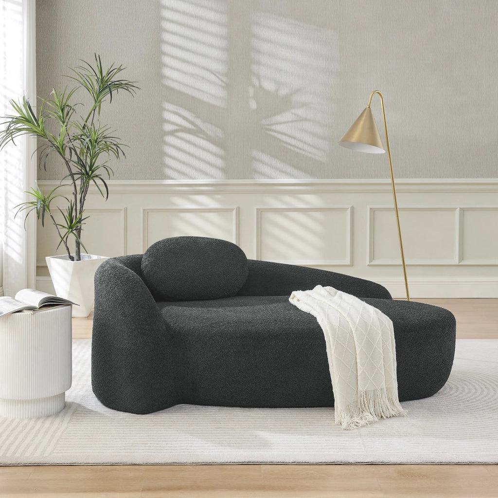 Divano minimalista in tessuto teddy nero con cuscino poggiatesta