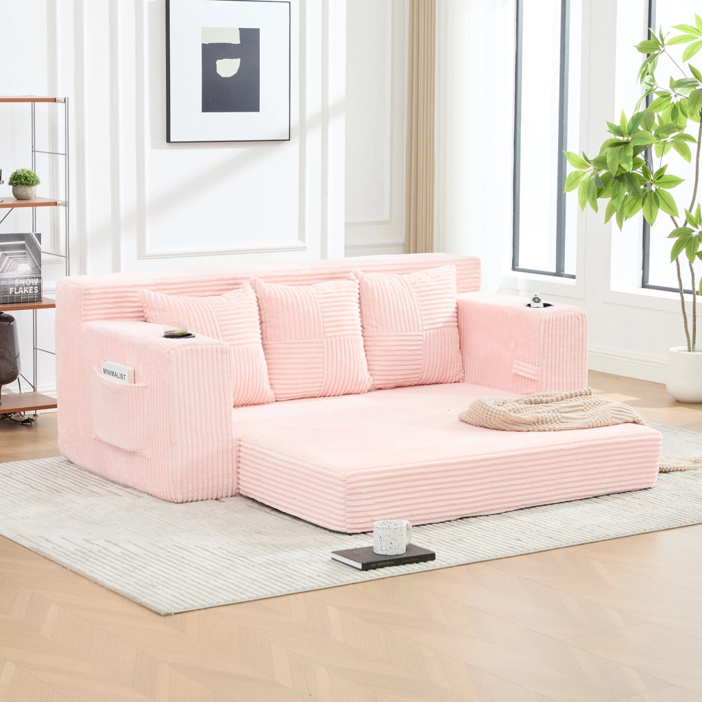 Divano tre posti in velluto a coste rosa; modulare salvaspazio con porta bicchieri