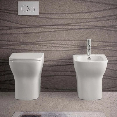 Wc filomuro bianco lucido senza brida con scarico multiplo  Plana