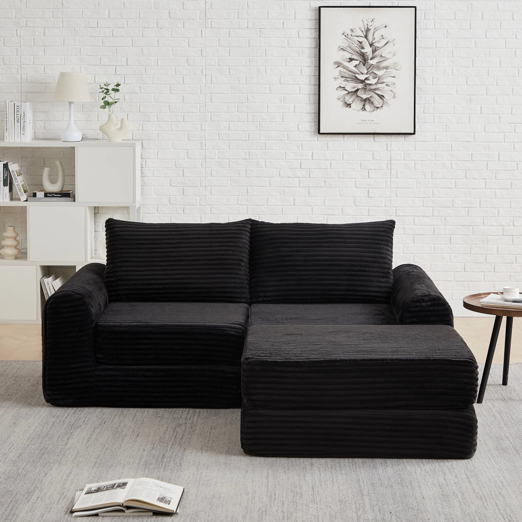 Divano letto modulare con pouf rimovibile e braccioli curvi, configurazione flessibile in velluto a coste nero