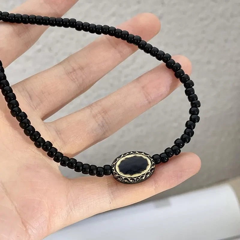 Collana vintage barocca con perline nere e oro, regalo di Natale o compleanno.