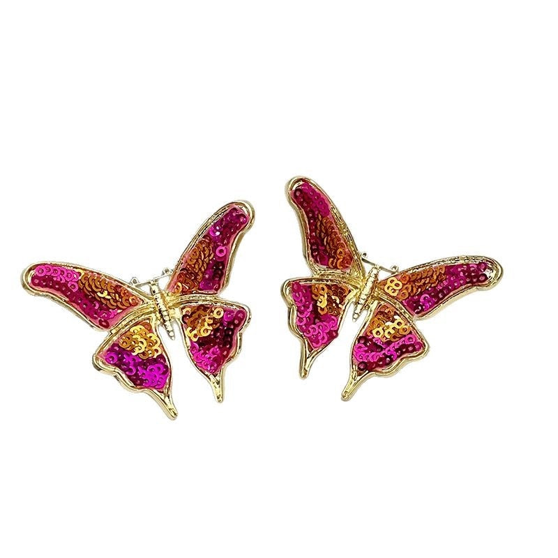 Orecchini a farfalla rosa con perline e paillettes