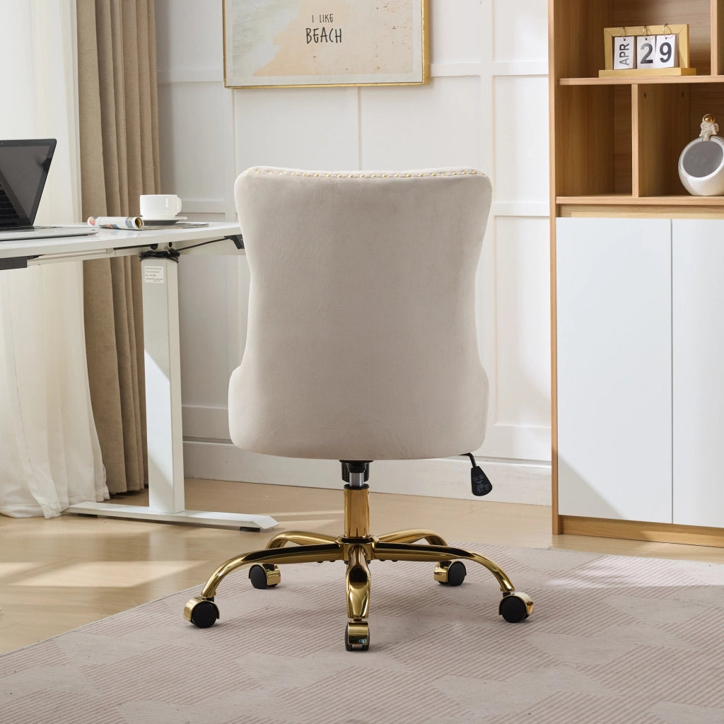 sedia da ufficio con seduta ampia e profonda; schienale trapuntato; base in metallo dorato; velluto beige