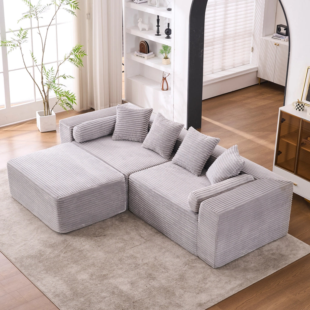 Divano angolare modulare senza attrezzi con chaise longue e seduta oversize per salotto in tessuto chenille grigio
