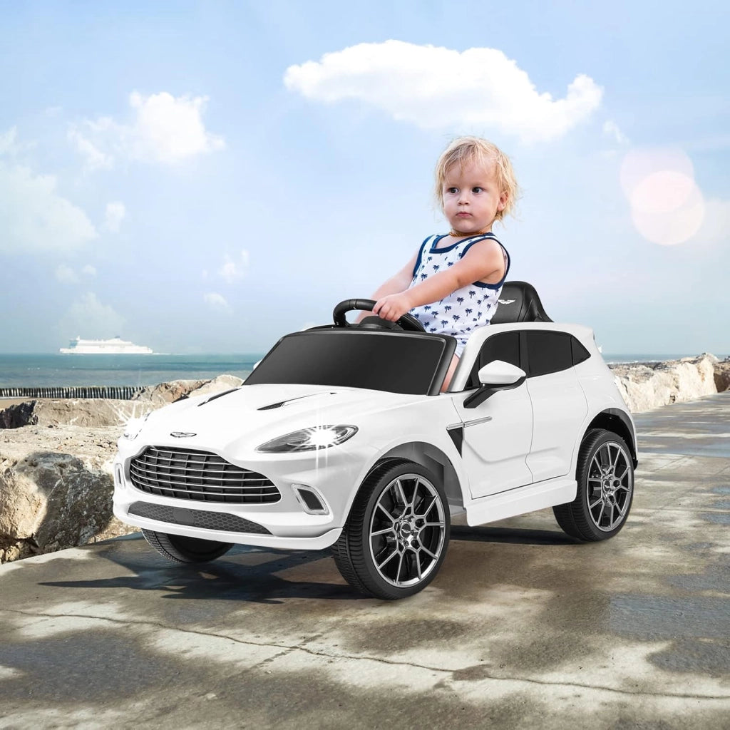Aston Martin DBX Auto Elettrica per Bambini, 12 V Macchina Elettrica con Telecomando e Luci LED, Partenza Lenta Clacson, Regalo per Bambini 3-8 Anni (Bianco)