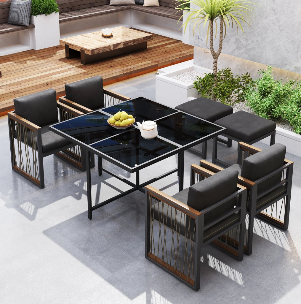 Set da giardino da pranzo 7 pezzi per 6 persone con tavolo in vetro temperato e cuscini; nero e naturale