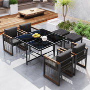 Set da giardino da pranzo 7 pezzi per 6 persone con tavolo in vetro temperato e cuscini; nero e naturale