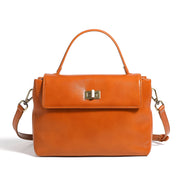 Borsa a mano e a tracolla da donna in vera pelle, colore arancione.