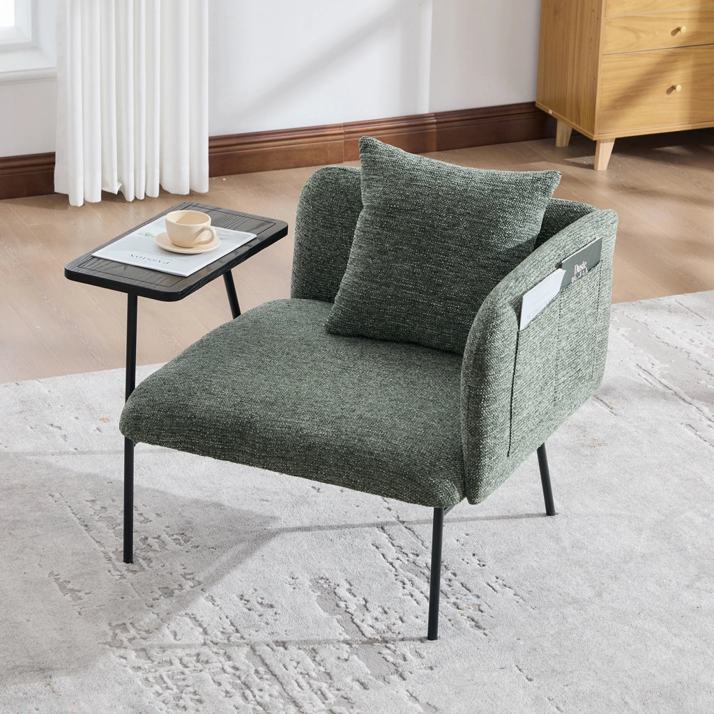 Poltrona moderna in chenille color smeraldo con tavolino laterale e tasche portaoggetti
