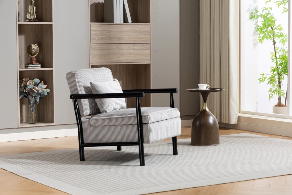 Poltrona contenitore in velluto grigio chiaro con struttura in legno e cuscino lombare