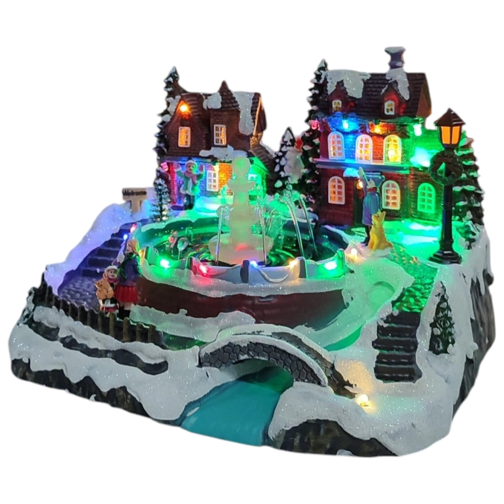 Villaggio Natalizio con Fontana Acqua Luci Musica Movimento 26cm LED Multicolor