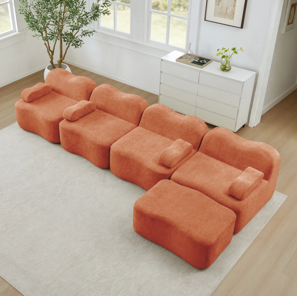 Divano angolare modulare 384x167x70 cm in velluto arancione con pouf collegabile