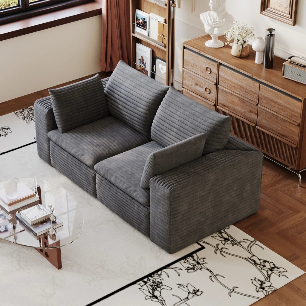 Divano modulare in tessuto grigio scuro con supporto in schiuma; design componibile