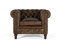 Poltrona Chester realizzata in pelle con finitura capitonné