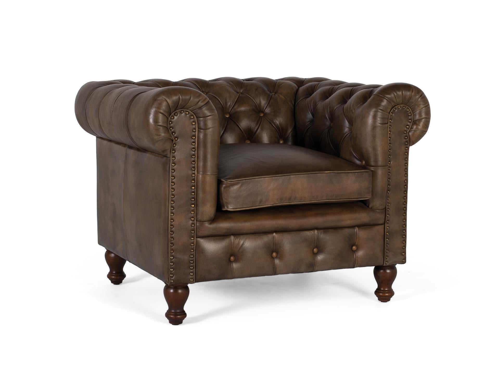 Poltrona Chester realizzata in pelle con finitura capitonné