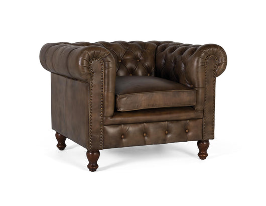 Poltrona Chester realizzata in pelle con finitura capitonné