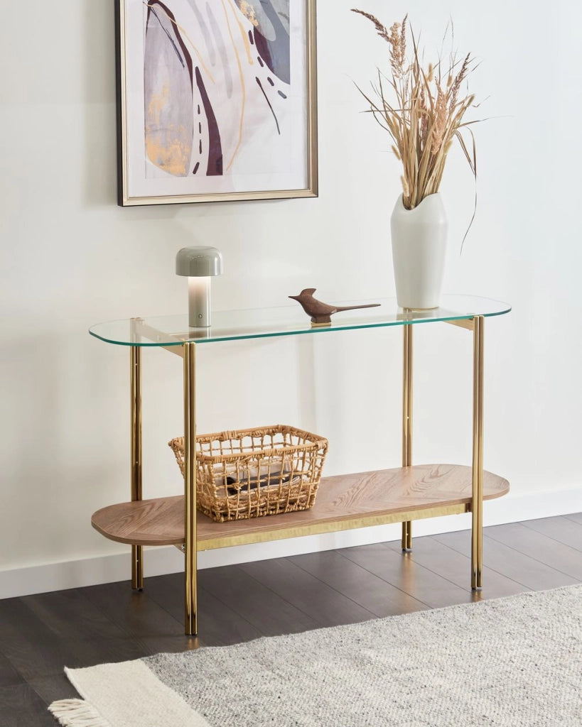 Tavolo console con piano in vetro temperato e struttura in metallo 1 ripiano in legno chiaro e oro stile moderno