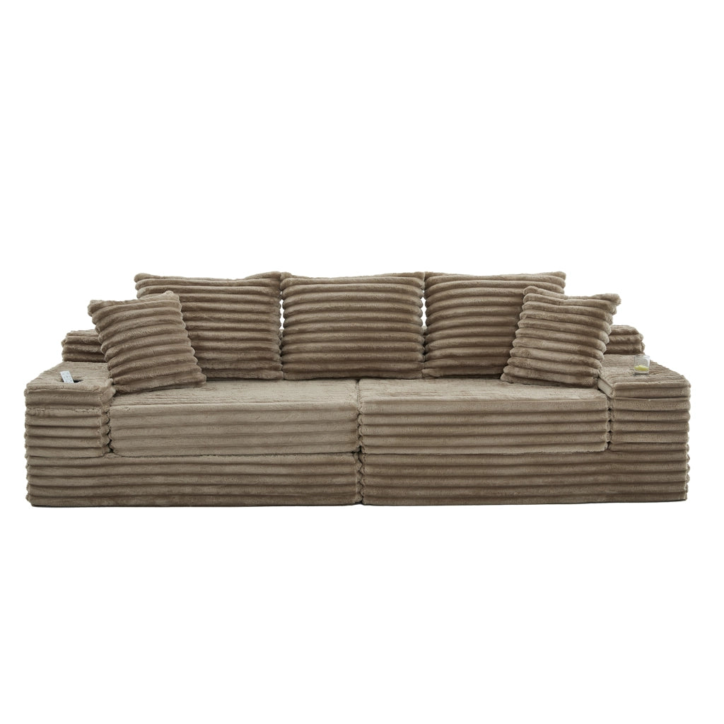 Divano in velluto a coste color khaki, schienale alto, tasche laterali e portabicchieri, modulare e trasformabile in divano letto