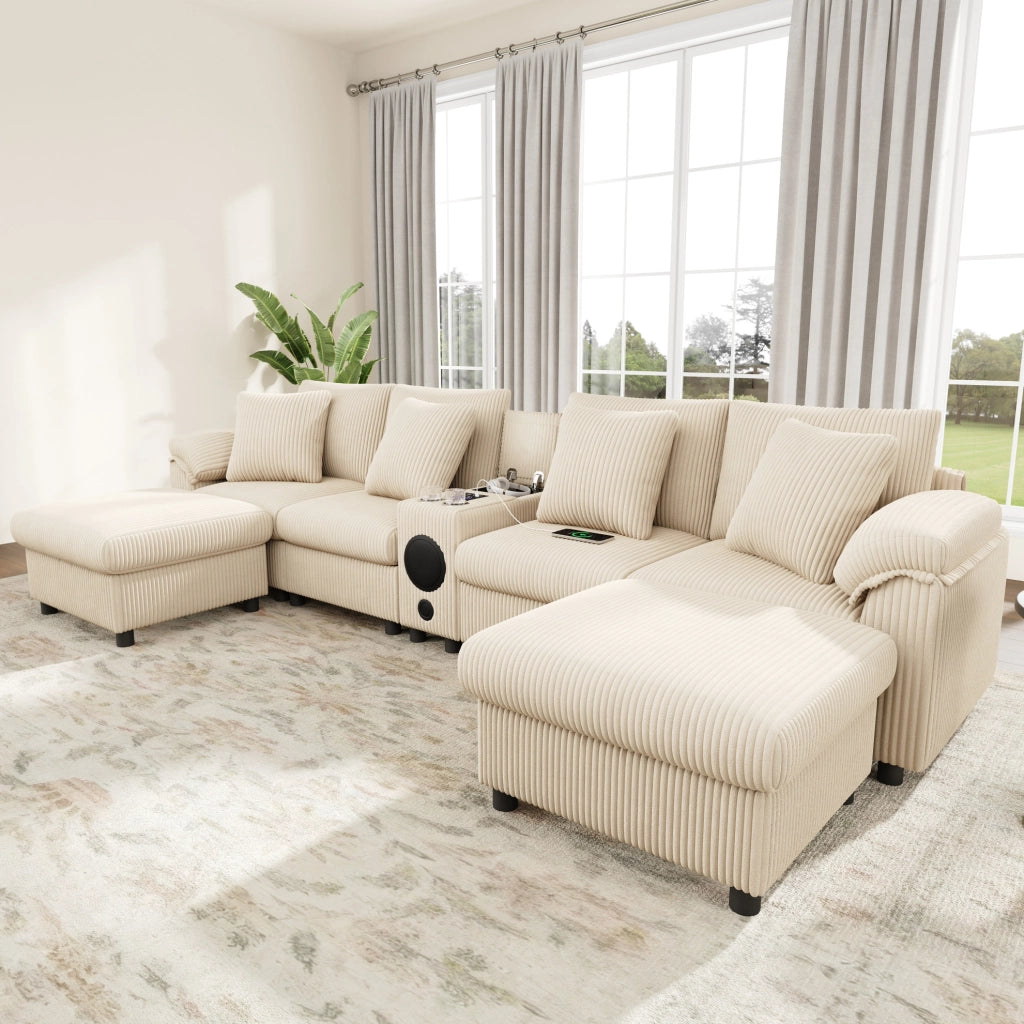 Divano modulare U/L in velluto a coste beige con console Bluetooth; ricarica wireless; USB e Type-C