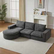 Divano componibile a L con chaise longue in chenille grigio con cuscini, supporto in ferro e moduli reversibili