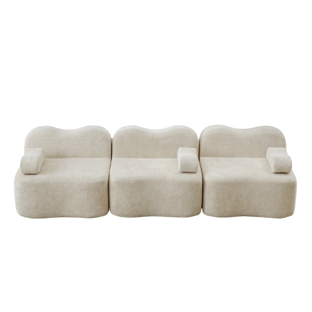 Divano modulare beige in velluto con seduta profonda e braccioli