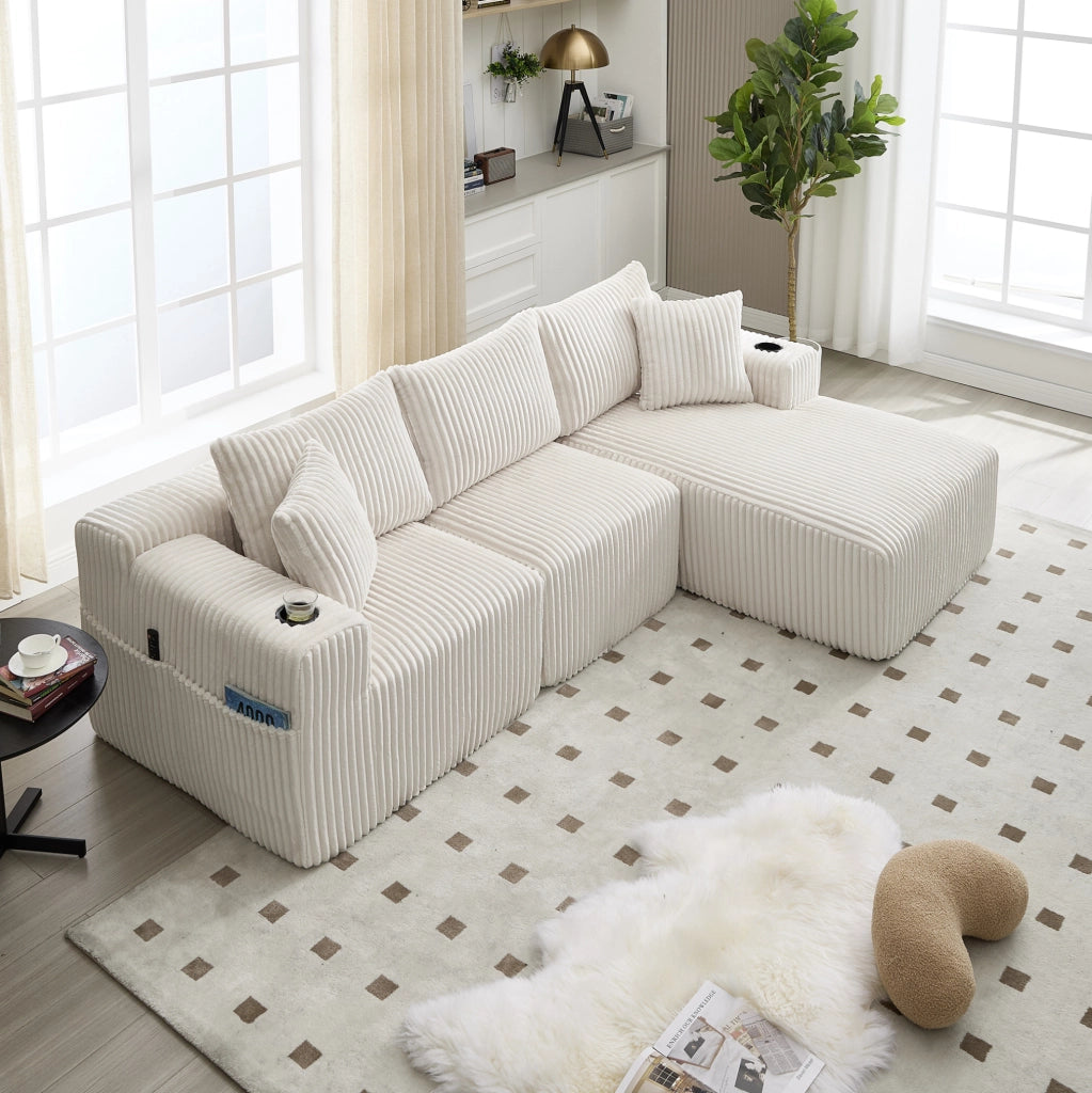 Divano modulare 257x160x62 cm con 5 cuscini; tasche laterali e portabicchieri in corduroy beige