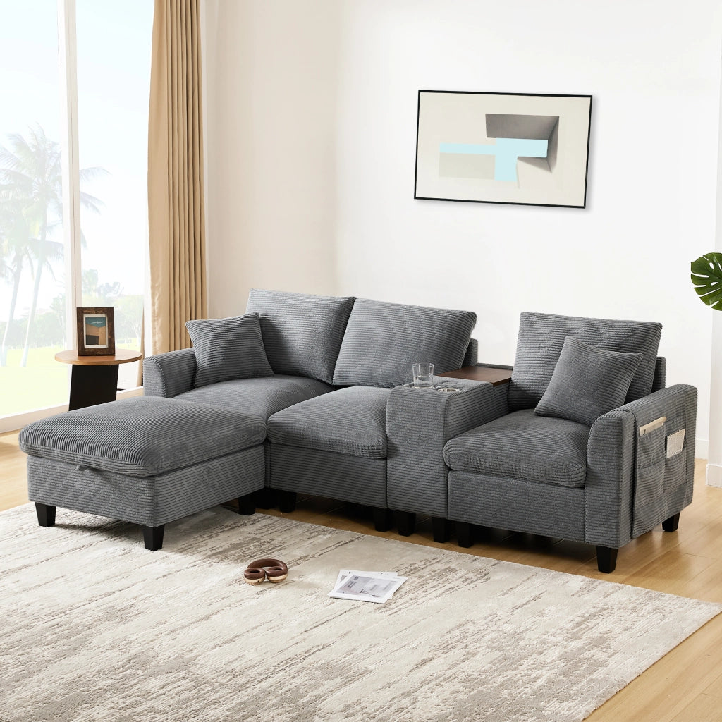 Divano angolare modulare in corduroy con consolle centrale porte USB portabicchieri e cuscini grigio per soggiorno