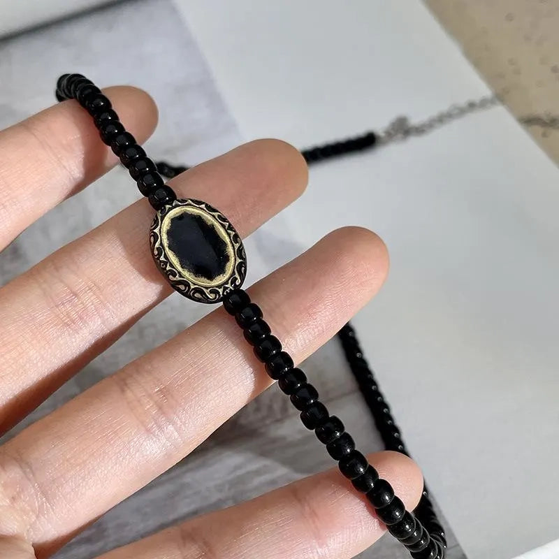 Collana vintage barocca con perline nere e oro, regalo di Natale o compleanno.