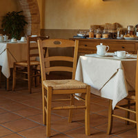 Sedia da pranzo Loris in legno finitura noce chiaro con seduta in paglia