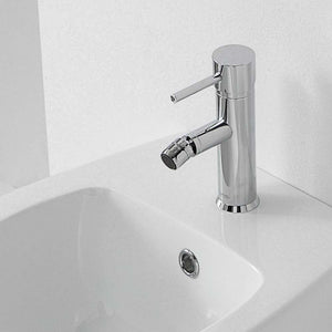 Rubinetto suvi per bidet dotato di scarico, caratterizzato da un design minimale e linee tonde