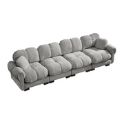 Divano modulare 4 posti con cuciture trapuntate e cuscino lombare in chenille grigio chiaro