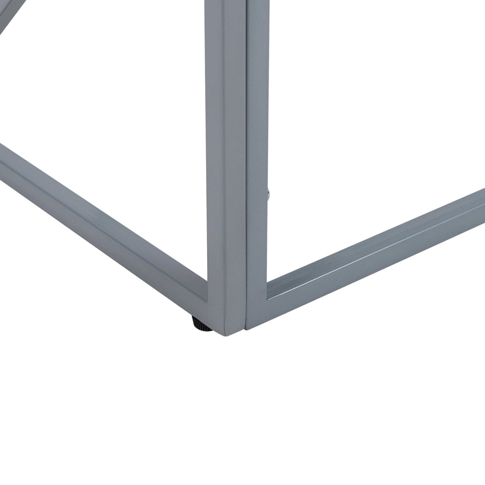 Tavolino da caffè con struttura in metallo argento piano in vetro design geometrico glam