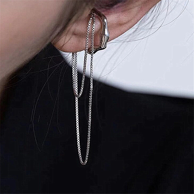 Nuovo orecchino a clip irregolare con catenella e nappa, ideale per orecchie non forate.