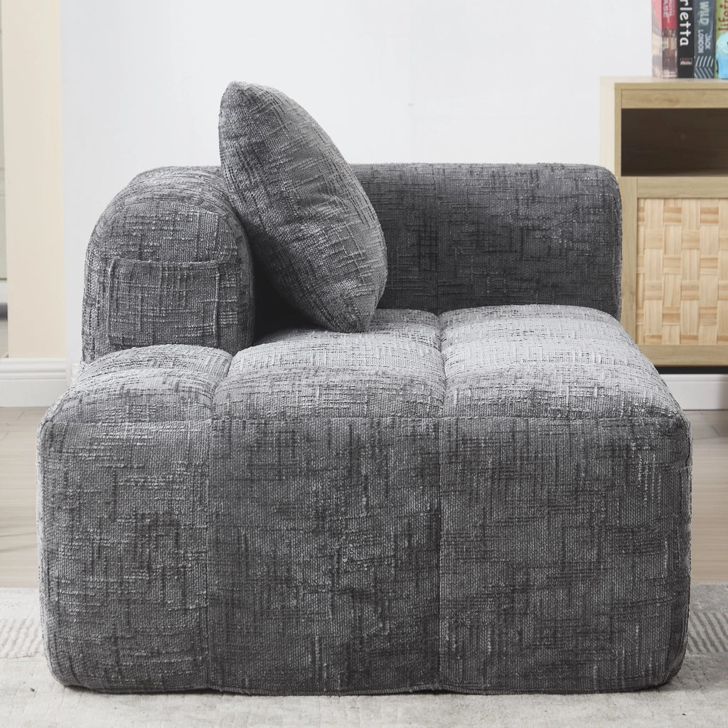 Divano chaise longue moderno in chenille grigio con cuscino e tasche laterali; 158x90x60 cm