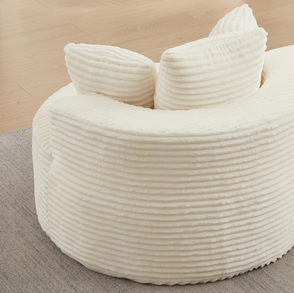 Poltrona relax rotonda in velluto a coste beige con tre cuscini