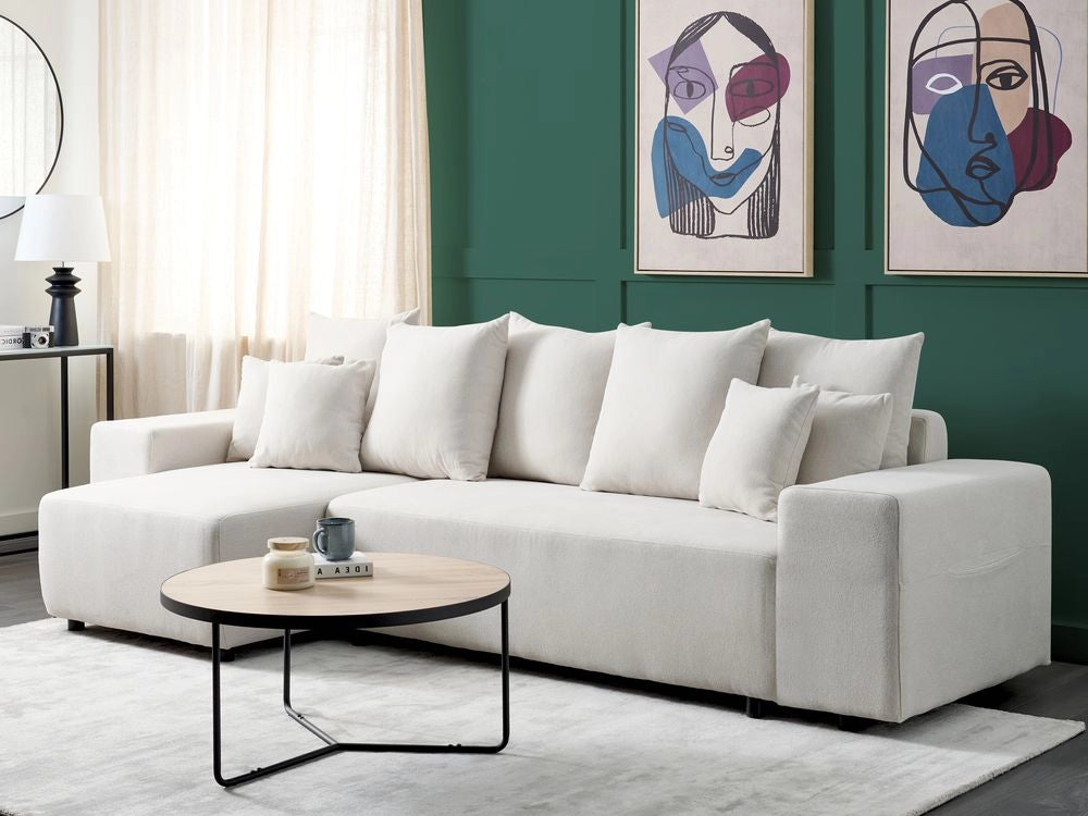 Divano angolare a destra in tessuto beige chiaro a 3 posti con cuscini extra sparsi Soggiorno moderno