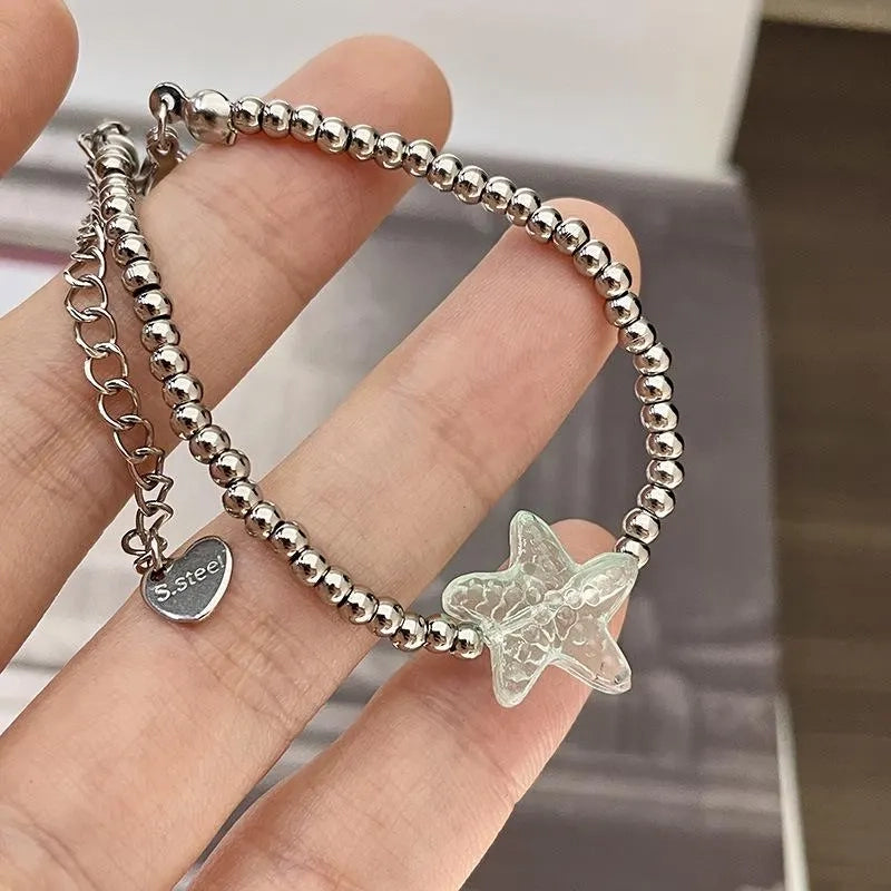 Set di gioielli boh¨¦mien fatti a mano con perline: bracciale, anello e collana.
