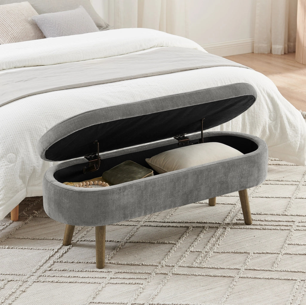 Panca contenitore ovale 110x40x42 cm in chenille grigio scuro con vano 20L