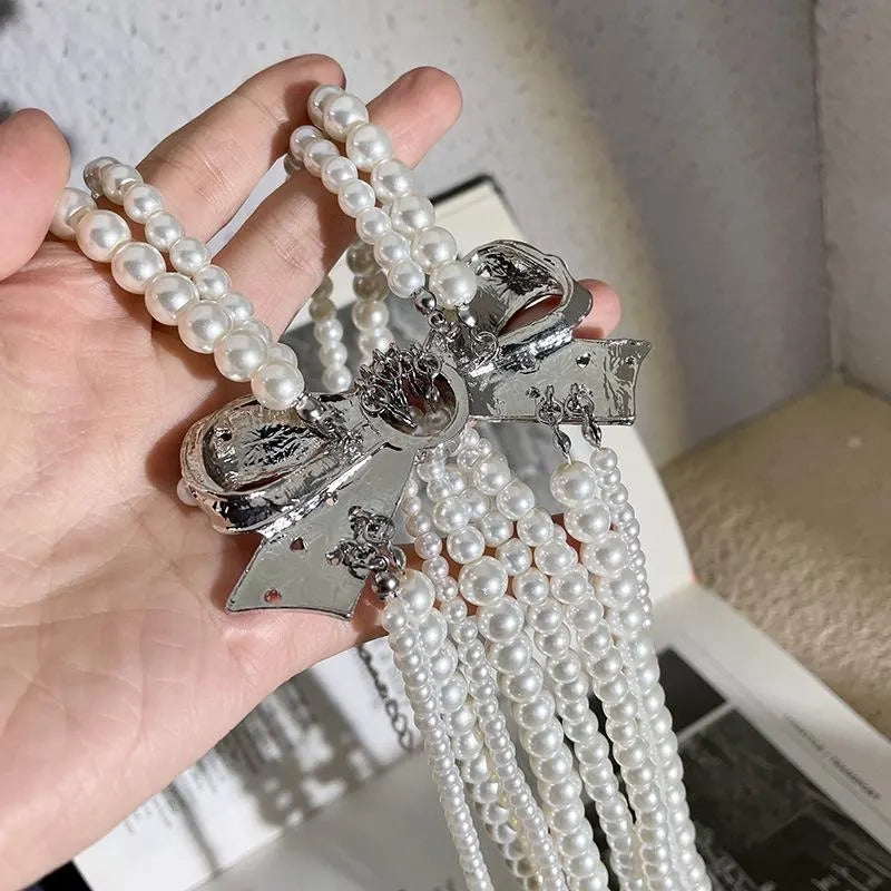 Collana con fiocco doppio strato e nappa di perle, realizzata a mano, regalo di Natale o di compleanno.