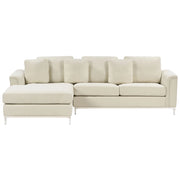 Divano ad angolo rivestito in tessuto beige a forma di L con orientamento a versione destra